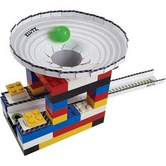 a lego model with a green ball in the middle of it's hole,