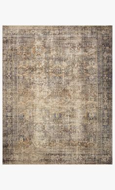 an old rug with faded colors and patterns on the bottom, in greys and browns