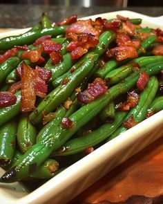 green beans with bacon in a white dish