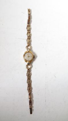 This vintage from 1960s Oris ladies' wind up wristwatch. Brand Oris. Movement  Wind-up mechanical. The case made of 9-carat rolled gold, a material for vintage watch. The watch face is small and round with Arabic numerals at 12, 3, 6, and 9 o'clock positions. The other hour markers are indicated by simple lines. The hands are classic and straightforward, fitting the elegant style of the watch. This watch without second hand. The crystal covering the dial slightly domed. The band is a metal link Watches Women Vintage, Small Watches Women, Wrist Clock, Small Watches, Ladies Dress Watches, Small Watch, Jewelry Lookbook, Watch Faces, Women Wrist Watch