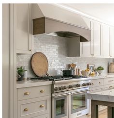 a stove top oven sitting inside of a kitchen