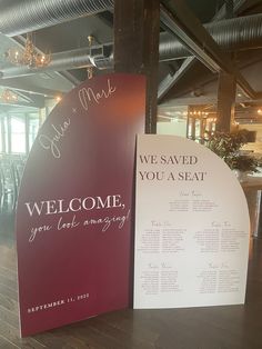 a welcome sign is next to a seating chart