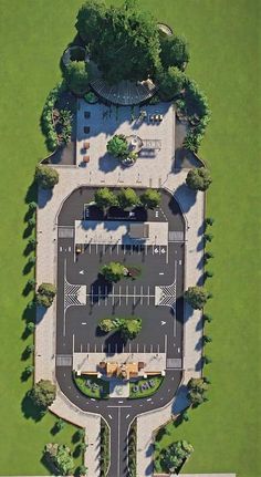 an aerial view of a parking lot in the middle of a park