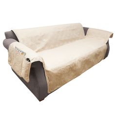 a couch covered in a beige and black cover