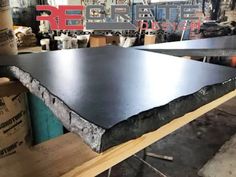 a table that has some kind of black slab on it