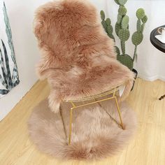 a chair that is sitting in the middle of a room with a rug on it