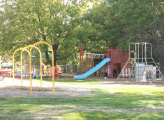 children's play area with slide and swings