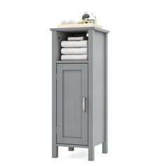 a gray cabinet with towels on top of it