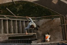 a man on a skateboard is doing a trick