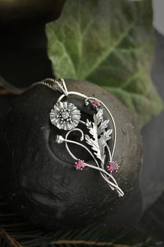 ITEM DESCRIPTION: The size  H 3 cm x W 5 cm  Weight - 6 g.  You can buy it with a silver chain or without it. I made this Poppy flower pendant of sterling silver and rhodolite. You can order this pendant with other stones, just message me about this. The plant is very detailed, but at the same time, it looks elegant and romantic. The botanical necklace is worthy of being in your precious collection. Expect many compliments on this!   This handmade necklace will come to you in a gift box - ready Poppy Jewelry, Botanical Necklace, Plant Necklace, Poppy Necklace, Shark Necklace, Copper Crafts, Wedding Pendant, Botanical Jewelry, Poppy Flower