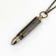 This hollow brass bullet canister measures 2" long. The bail unscrews to reveal a tiny spoon discreetly concealed inside the pendant when worn as a necklace. The entire piece is made of solid brass with a hand burnished antique finish giving it a vintage appeal as it hangs from its burnished bronze chain. Tiny Spoon, Apocalypse Gear, Tiny Spoons, Spoon Necklace, Feather Jewelry, Boho Gifts, Antique Finish, Canisters, Boho Jewelry