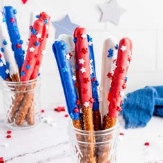 red, white and blue pretzel sticks in a jar with confetti