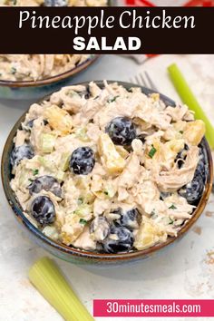 two bowls filled with blueberries and chicken salad