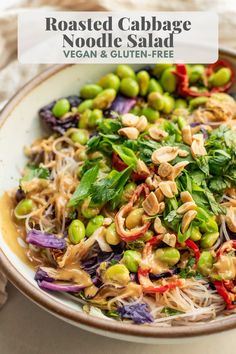 a white bowl filled with vegetables and sprouts