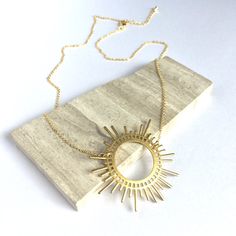 Gold Sunburst Necklace A Large Golden Sunburst Pendant Is The Centerpiece Of This Necklace. It Is Paired With A Delicate Gold Chain & Extender. Fun, Whimsical And Powerful, This Is A Great Everyday Necklace! Excellent Quality Gold Plated Chain & Lobster Clasp, Small Golden Drop At The End Of The Extender. Brass Sun Pendant. Approx. Size: Overall 17"18"L, 1-1/4" Extender, Pendant 1-3/4 "W A Natural & Delicate Necklace. Mystical Witches Statement Necklace! Boho Sun Goddess, Circle Necklace Goddess Circle, Sunburst Necklace, Delicate Gold Chain, Gold Sunburst, Sun Goddess, Boho Sun, Sun Pendant, Chain Extenders, Everyday Necklace