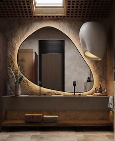 a bathroom with an oval mirror above the sink