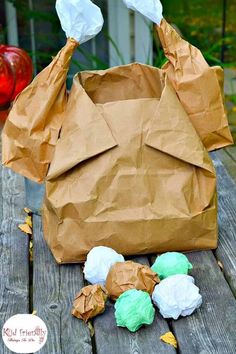 a brown paper bag sitting on top of a wooden table