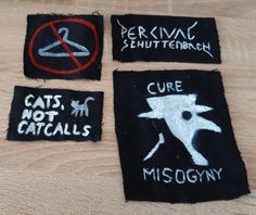 four patches that have been embroidered onto each other with words on them, including cats and misgowny