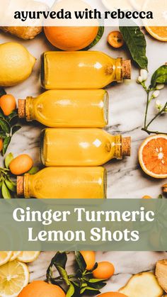 ginger turmeric lemon shots with oranges on the side