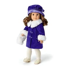 a doll is wearing a purple coat and white hat with fur on it's head