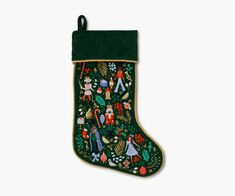 a christmas stocking with an image of people and animals on it's side