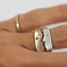 Custom signature Kiss Rings come as a set of two. You can select two of the same size if you intend to wear them together, or choose two different sizes if you want to gift one or wear them on different fingers. Ring one is pictured on the bottom of of the set & is the ring with the nose. Product details: Original designs carved in wax and cast the solid gold kiss rings are a smaller version of Oxbow's original kiss rings the set is ~11-12.5 grams (variations depend on ring size and metal) Signet style, each face is 6mm wide, stacked together the rings are 12mm wide Option to add a gemstone or birthstone eye in one or both rings Rings may take two-three weeks to ship, as these rings are made custom for you With further customization questions, please reach out to me hello@oxbow-designs.com Rings Mixed Metals, Wax Carved Ring, Wax Carving Jewelry, Gold Pinky Ring, Custom Signature, Signet Rings, Rings Rings, Silver Art, Pinky Ring