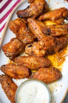 chicken wings with ranch dressing on a plate