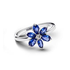 Sparkle in color with the Sparkling Herbarium Cluster Ring. Featuring man-made crystals in the shape of a flower, this sterling silver ring celebrates the beauty of nature. A cluster of alternating pear-shaped and marquise-shaped blue stones are set around a clear center stone, their various shapes evoking the natural symmetry found in the outdoors. Gift it to a nature lover in your life or wear it yourself alongside other Pandora herbarium-inspired styles for an eye-catching coordinated look. Natural Symmetry, Blue Stones, Pandora Rings, Custom Pendants, Ring Size Guide, Blue Rings, Cluster Ring, Blue Stone, Chain Pendants