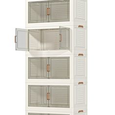 a tall white shelf with four doors and three shelves on each side, in front of a white background