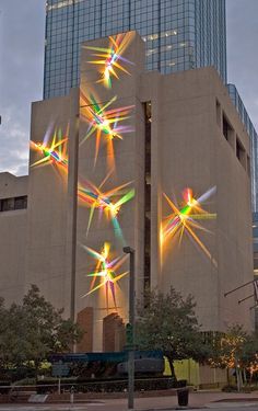 a large building with many lights on it's side