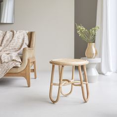 a chair and table in a white room