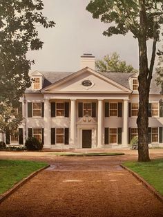 a large white house with columns on the front