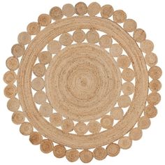 a round rug with circles in the center on a white background, it is made out of jute