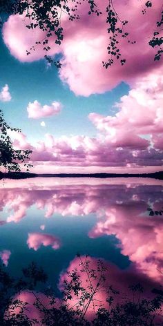 the sky and clouds are reflected in the water