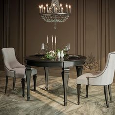 a dining room table with chairs and a chandelier