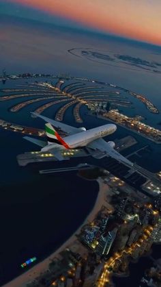 an airplane is flying over the city lights at night in this aerial view from above