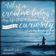 a person on a surfboard in the ocean with a quote about what is creative living