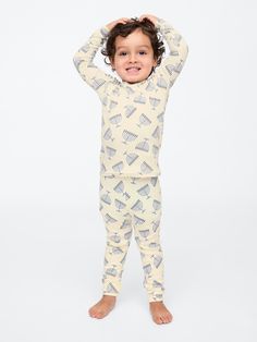 Soft cotton pajama top and pants set with a cozy brushed interior.  Crewneck.  Long sleeves.  Certain styles have embroidered Brannan Bear at chest.  Elasticized waist at PJ pants.  Assorted allover Holiday-themed prints.  Made with 100% organically grown cotton, which is grown without the use of synthetic pesticides and fertilizers.  This product was made in a factory that runs the Gap Inc.  P. A. C. E.  Personal Advancement & Career Enhancement) program.  P. A. C. E.  is our educational program that helps the women who make our clothes build the skills, knowledge, confidence & resilience needed to advance in work & life.  Learn more here.  Straight, easy fit.  Easy pull-on waist.  Sizes range from baby to toddler. Support People, Top And Pants Set, Pj Pants, Cotton Pyjamas, Pajama Top, Work Life, Brushed Cotton, Pj Sets, The Gap