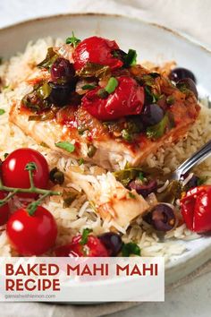 baked mahi mahi recipe on a plate with rice, cherry tomatoes and herbs