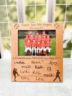 a wooden frame with a team photo on it