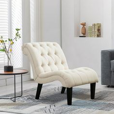 a living room with a couch, chair and coffee table