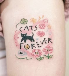 a woman's arm with a tattoo that says cats forever on it and flowers