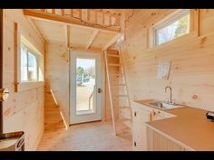 the interior of a tiny house with stairs