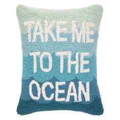 a pillow that says take me to the ocean