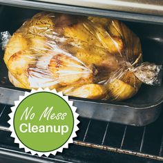 a roasted chicken in an oven with plastic wrap around it's head and the words no mess cleanup