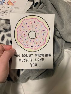 someone holding up a card that says you donut know how much i love you