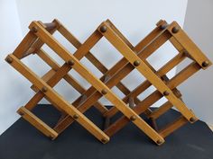 three wooden racks stacked on top of each other