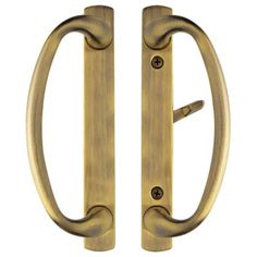 pair of brass door handles with rounded design on both sides, isolated against a white background