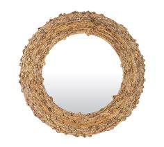 a circular mirror made out of branches on a white background with reflection in the middle