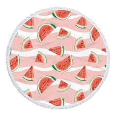 a round beach towel with watermelon slices on it